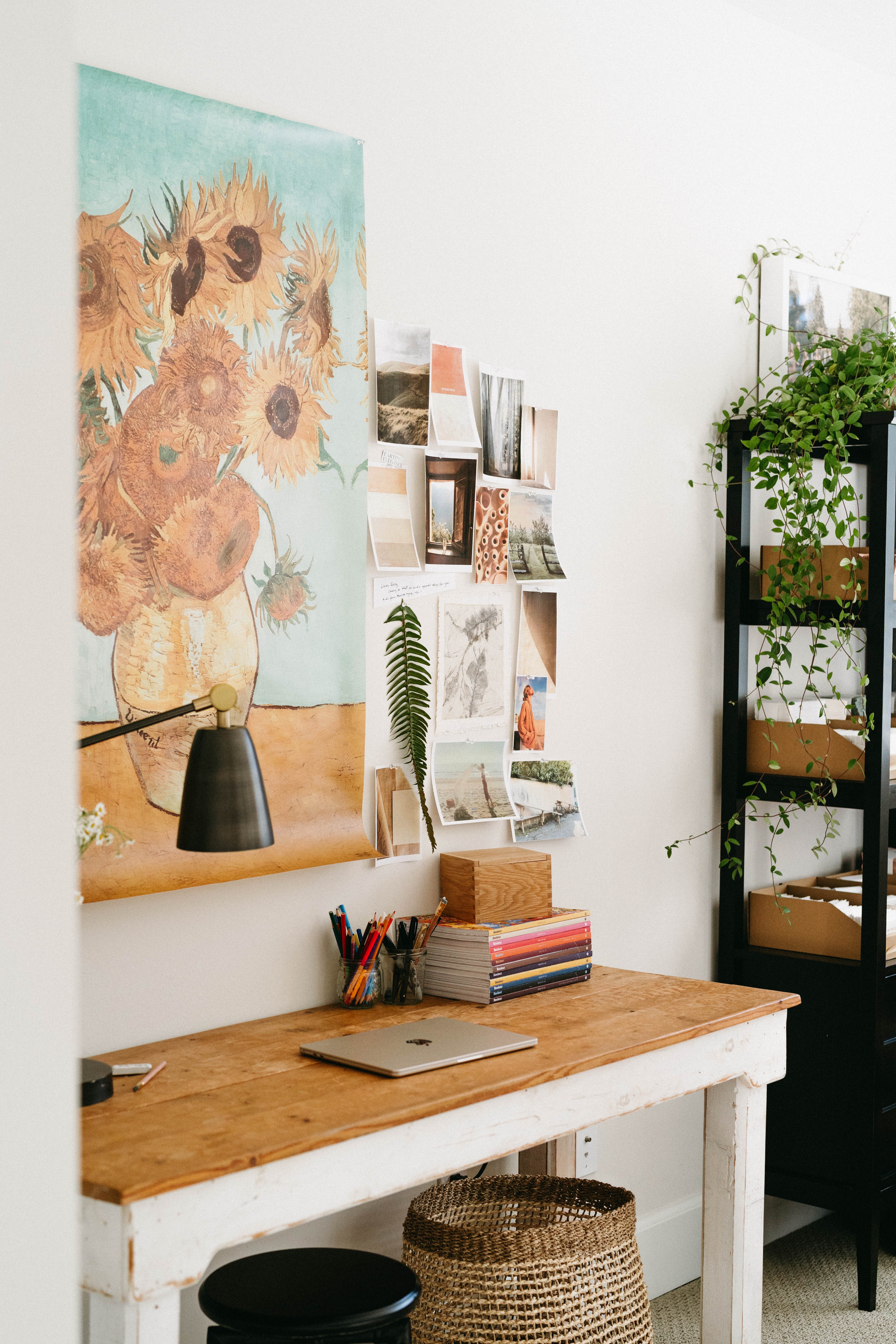 The Paper Way founder's studio space with inspiration board and desk.